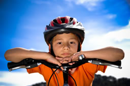 Child on bike with helmet